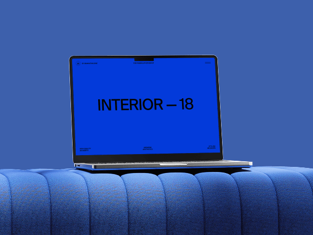 macbook mockup on blue tufted furniture