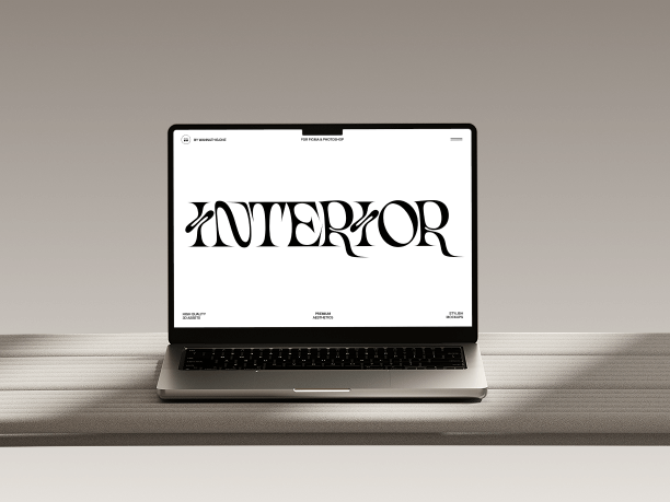 macbook mockup on light desk with grey wall