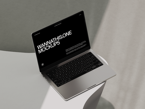 macbook mockup on sculpted white surface
