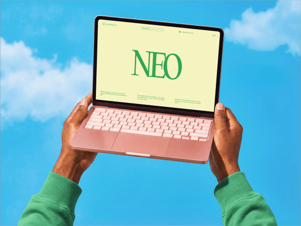 macbook mockup held in air by hands