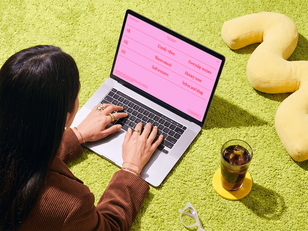 macbook mockup on a carpet with a person