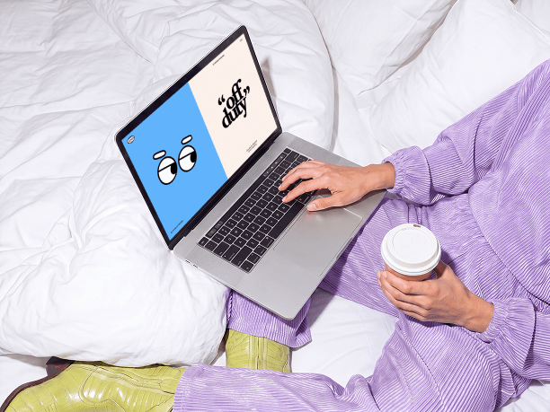 macbook mockup on a bed with coffee