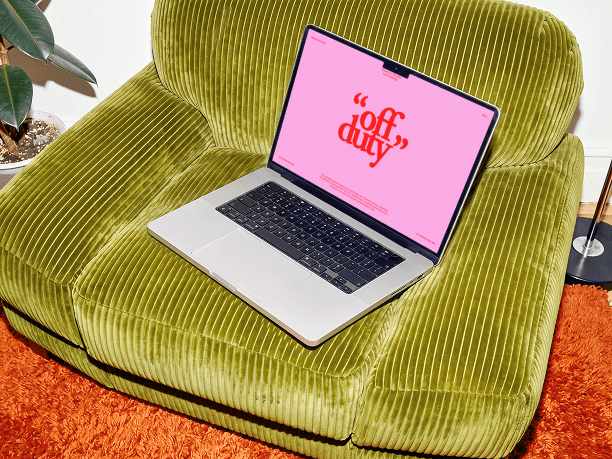 macbook mockup on a soft lounge chair