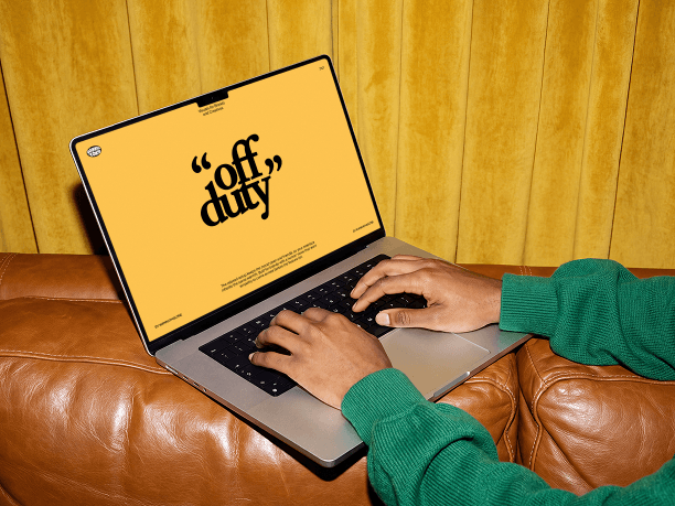macbook mockup with hands on the keyboard