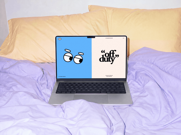 macbook mockup on a bed with pillows