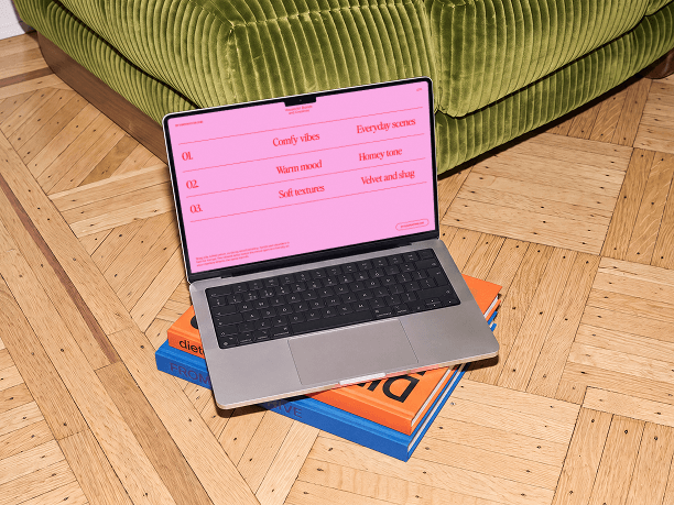 macbook mockup on a stack of books