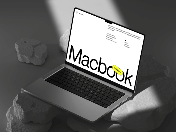 macbook pro mockup on rocks with dramatic light