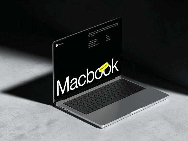 free macbook pro mockup on a concrete surface