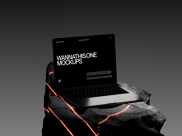 macbook on stone with red laser highlights