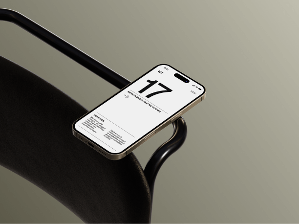 iphone 16 mockup on a grey chair