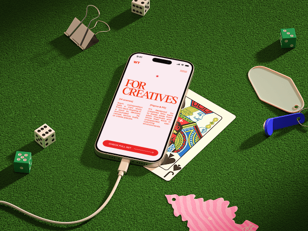 phone mockup on grass with toys and cards