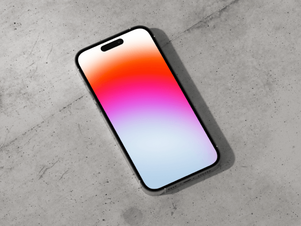 free iphone 14 pro mockup on concrete surface