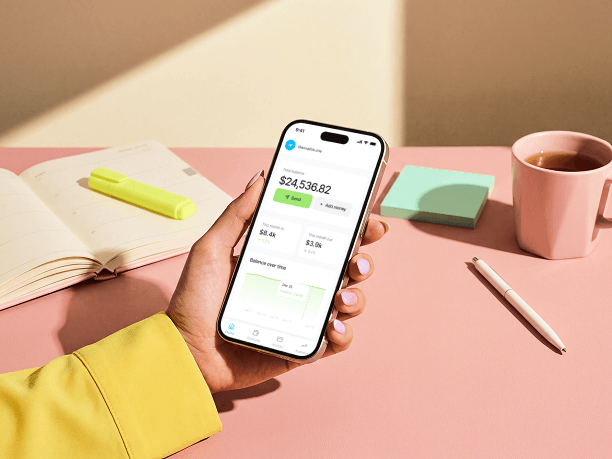 handheld iphone mockup at studio desk