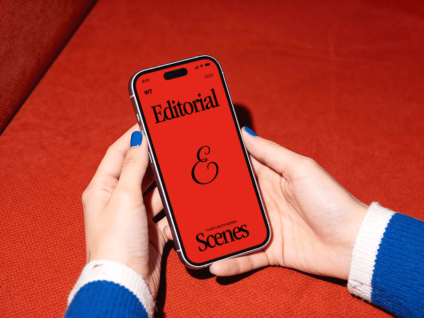 hands holding iphone on soft seating scene