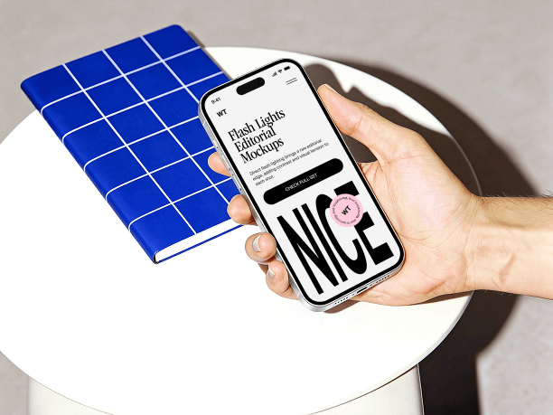 hand holding iphone on minimal table scene