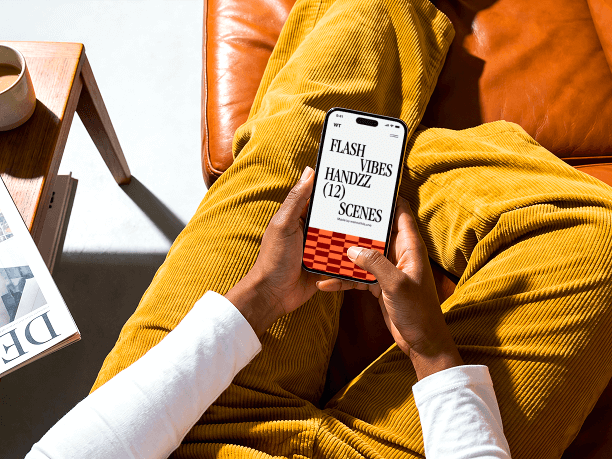 seated hands holding iphone editorial mockup