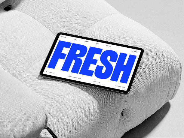 tablet mockup on white sofa cushion